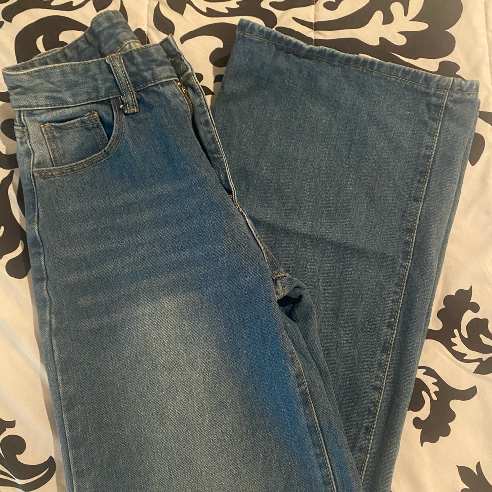 High waisted, wide legged blue jeans